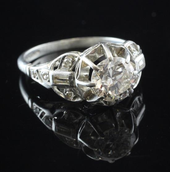 An early 20th century platinum and diamond ring, size L.